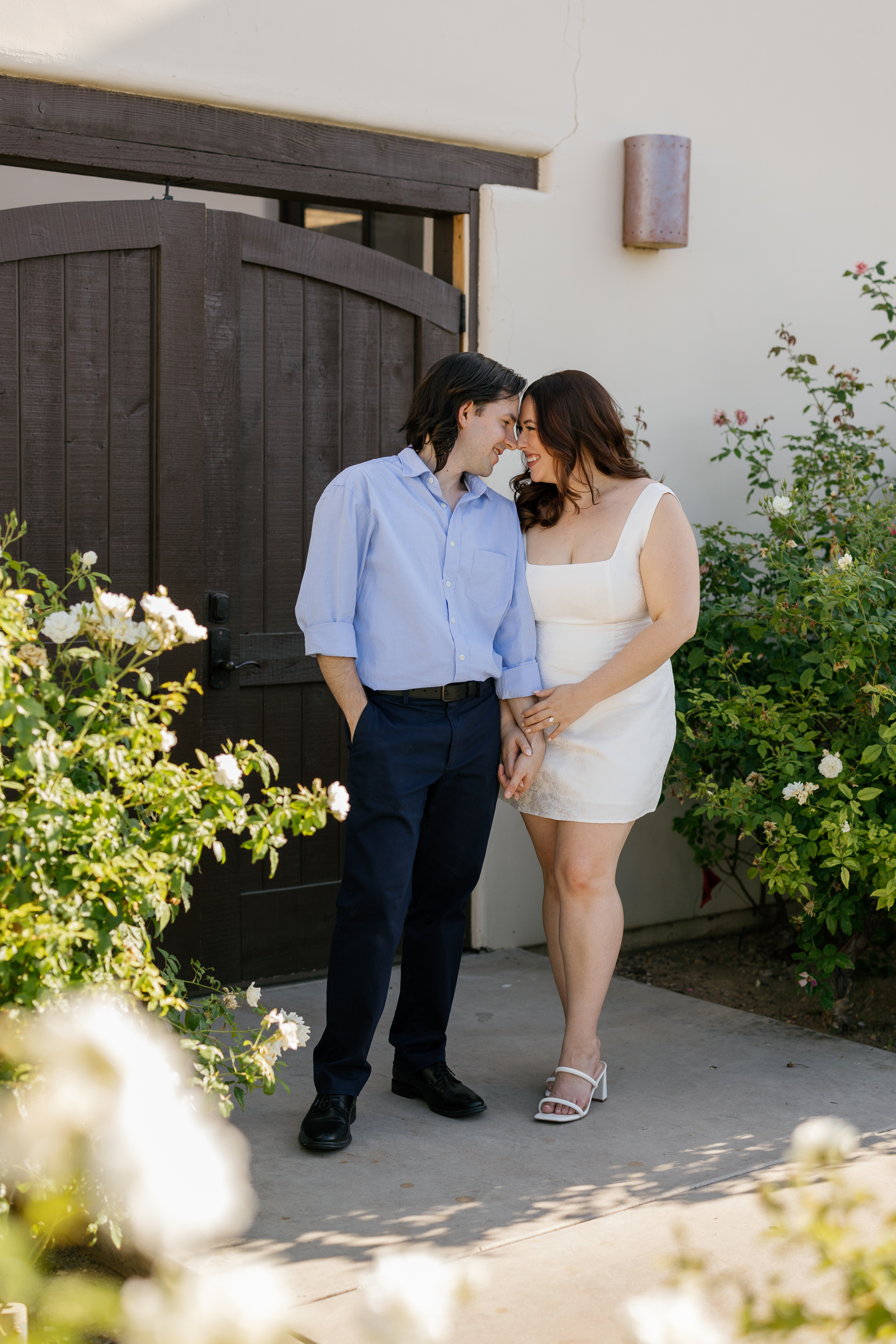 Amanda and Charlie standing and staring at each other